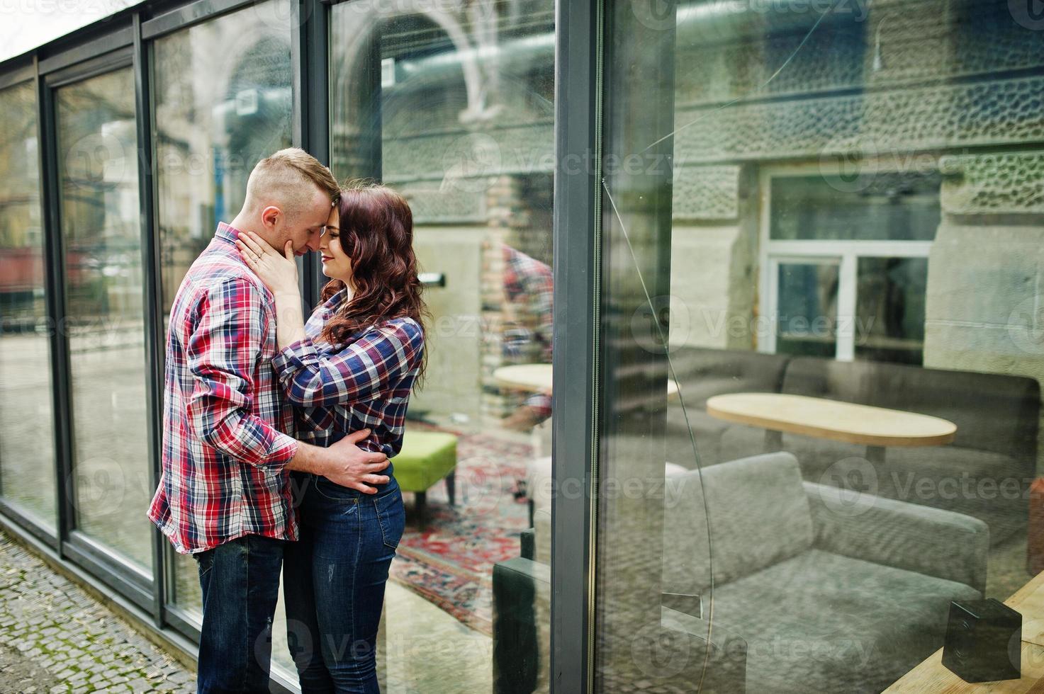 Stylish couple wear on checkered shirt in love together. photo