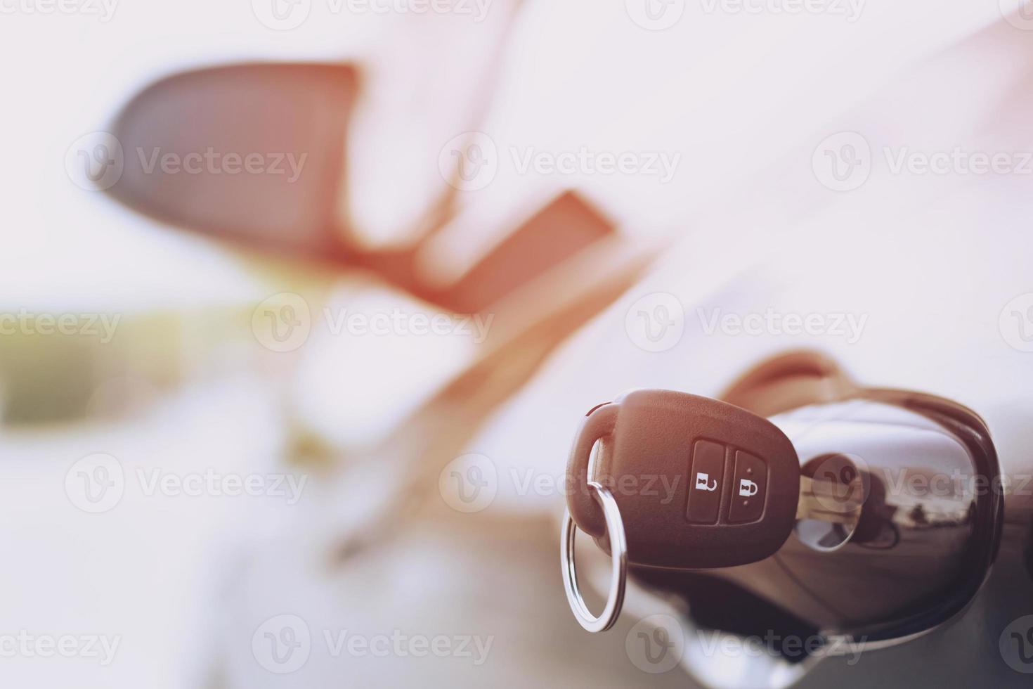 Ignition key of modern car close up. Car key in keyhole photo