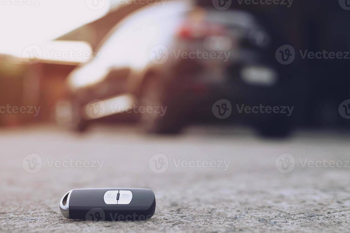 abstract car key fall on the cement ground - can use to display or montage on product photo