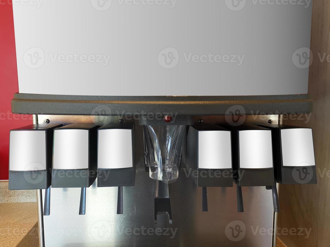 close up soda beverage machine on fast food restaurant photo