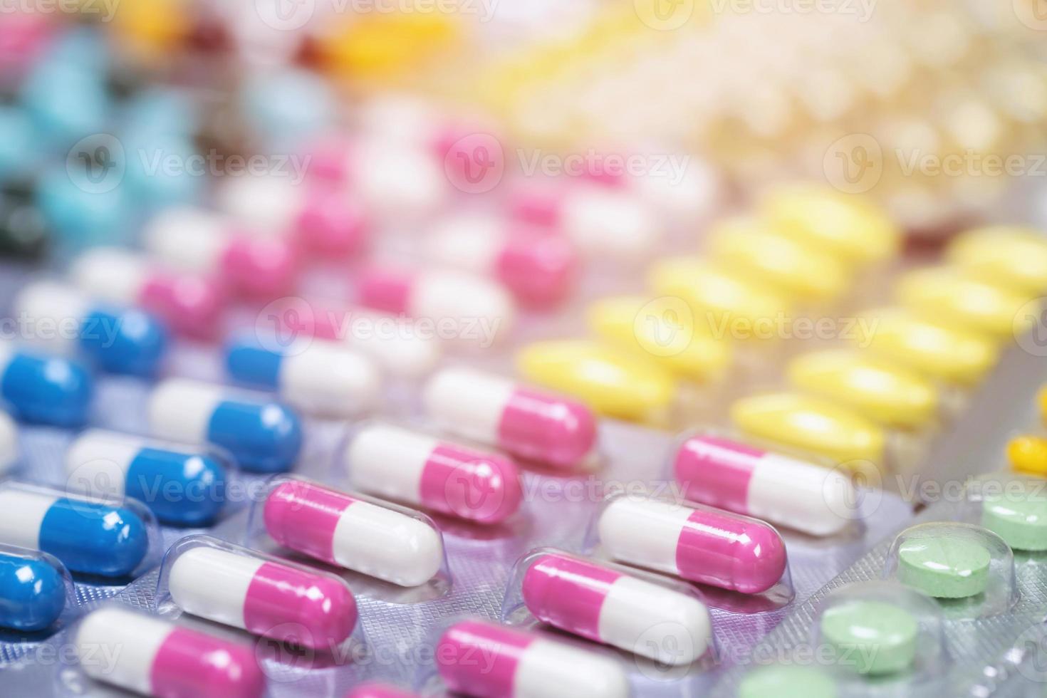 close up pharmaceuticals antibiotics pills medicine in blister packs stack pile. colorful antibacterials pills Pharmacy. capsule pill medicine Antimicrobial drug resistance. Pharmaceutical industry photo