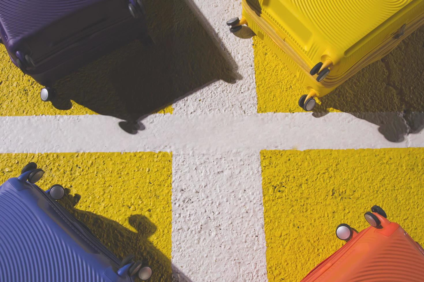 baggage luggage suitcase colorful placed on floor street concrete the square schedule color yellow. travel holiday summer concept and idea creative. Leave copy space empty to write a message. photo