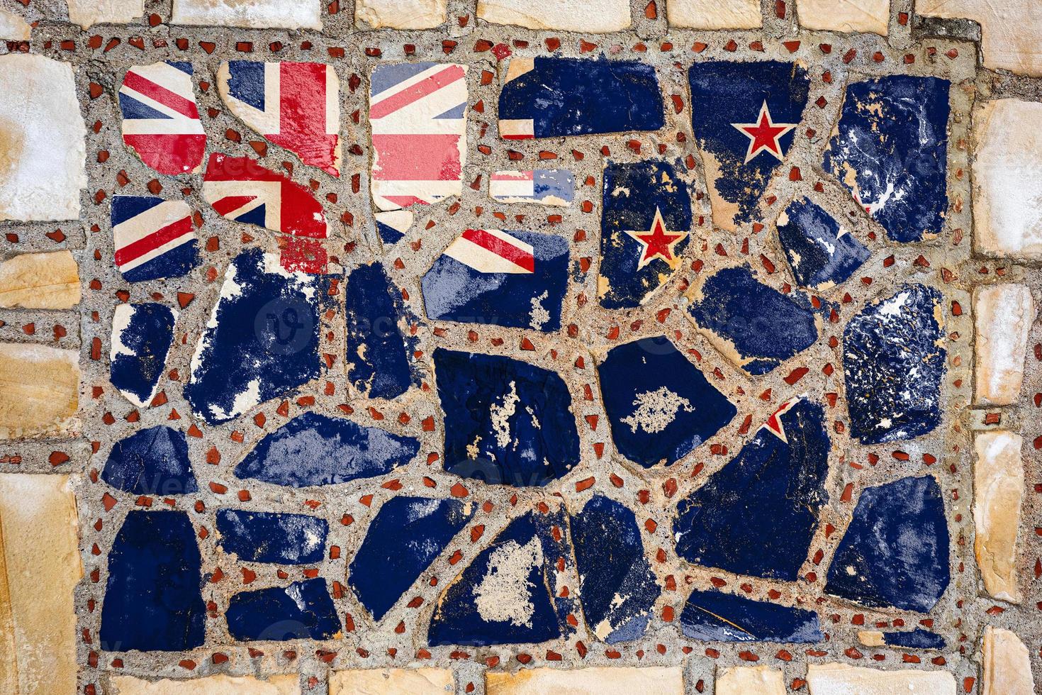 National flag of New Zealand on stone  wall background. Flag  banner on  stone texture background. photo