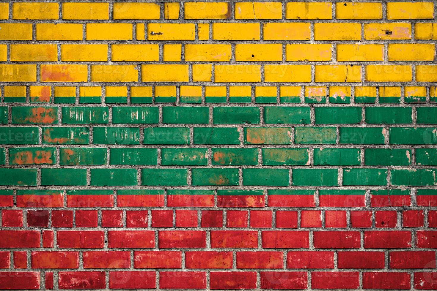 National  flag of the Lithuania  on a grunge brick background. photo