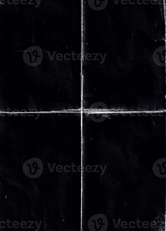 Folded paper with grungy texture in black background. can be used to replicate the aged and worn look for your creative design. old paper for photo texture overlay in retro style