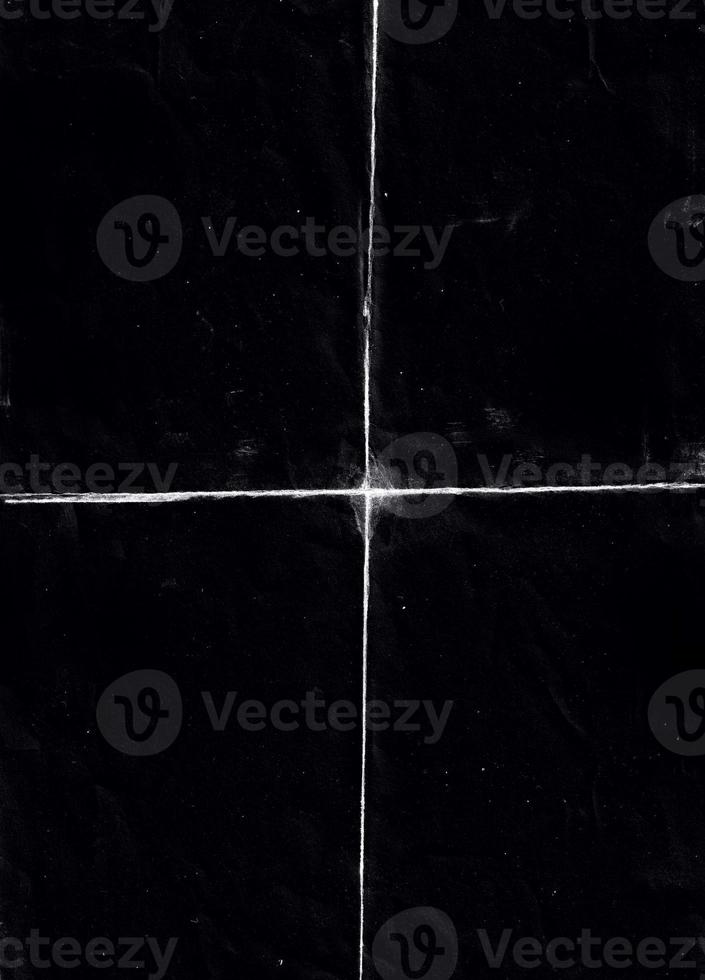 Folded paper with grungy texture in black background. can be used to replicate the aged and worn look for your creative design. old paper for photo texture overlay in retro style
