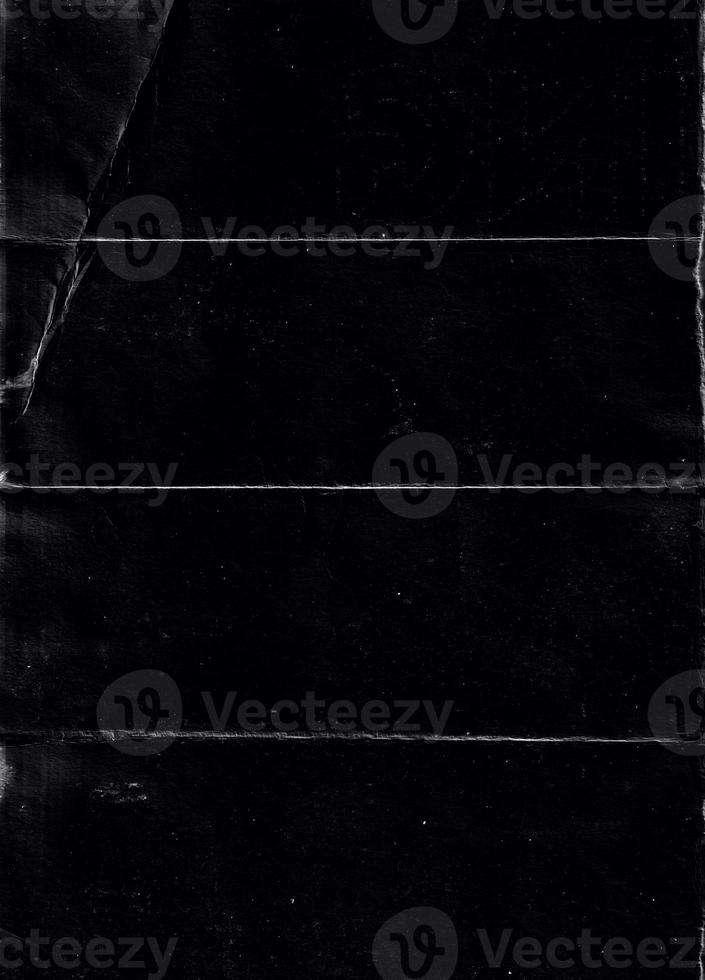 Folded paper with grungy texture in black background. can be used to replicate the aged and worn look for your creative design. old paper for photo texture overlay in retro style