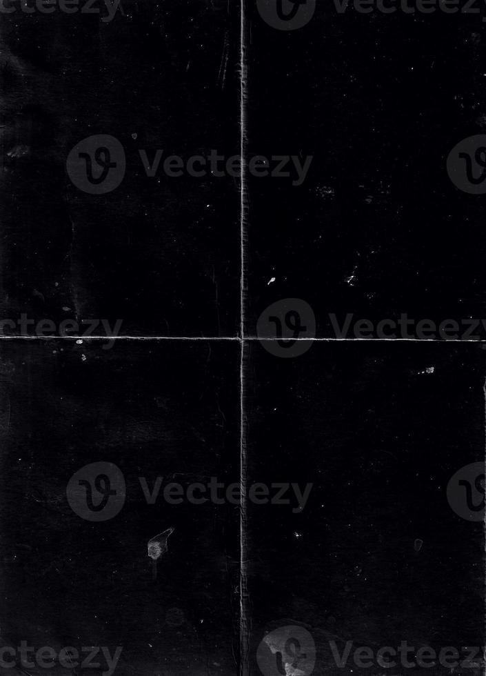 Folded paper with grungy texture in black background. can be used to replicate the aged and worn look for your creative design. old paper for photo texture overlay in retro style