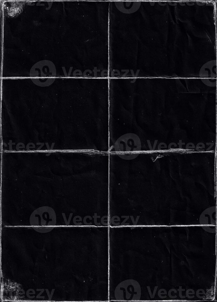 Folded paper with grungy texture in black background. can be used to replicate the aged and worn look for your creative design. old paper for photo texture overlay in retro style