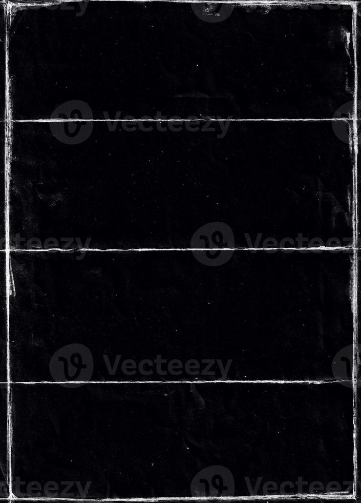 Folded paper with grungy texture in black background. can be used to replicate the aged and worn look for your creative design. old paper for photo texture overlay in retro style
