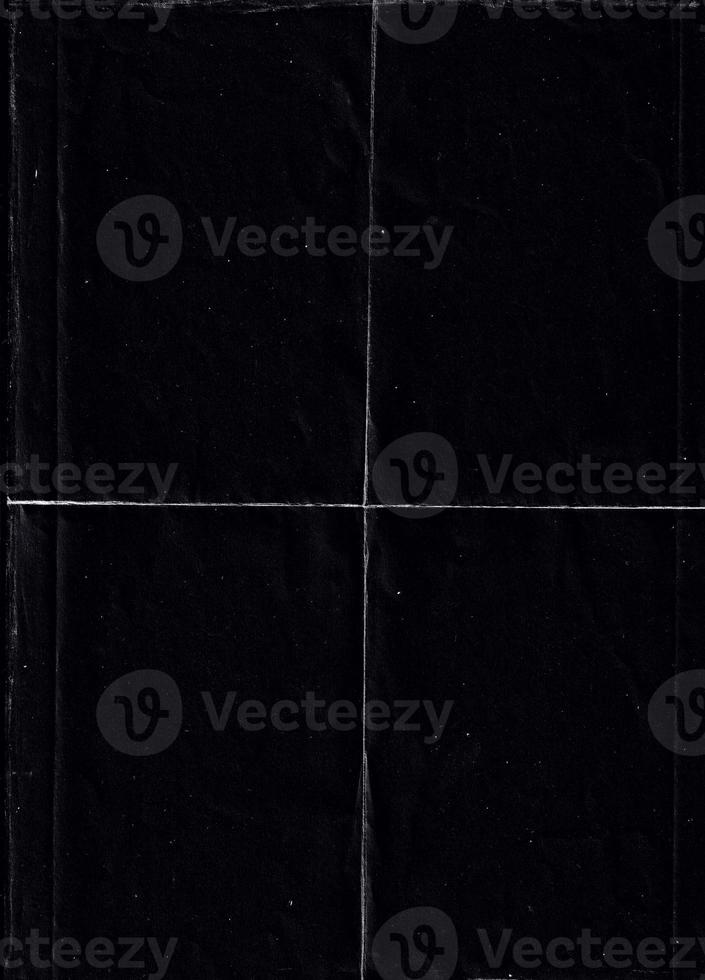 Folded paper with grungy texture in black background. can be used to replicate the aged and worn look for your creative design. old paper for photo texture overlay in retro style