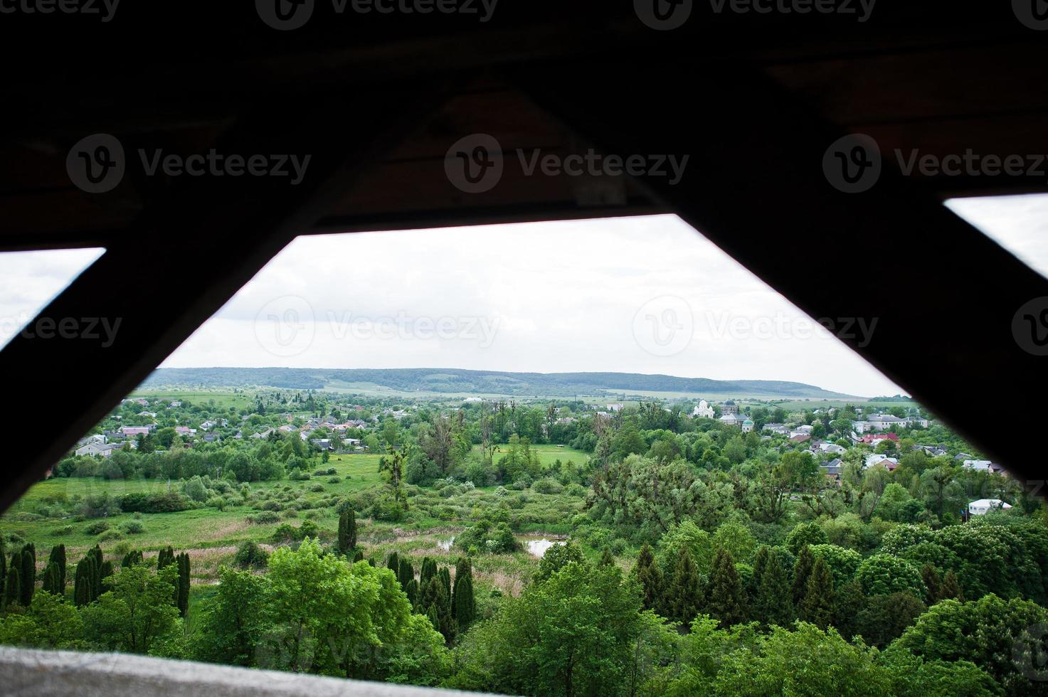 Picturesque view at rural landscape with trees and houses. photo