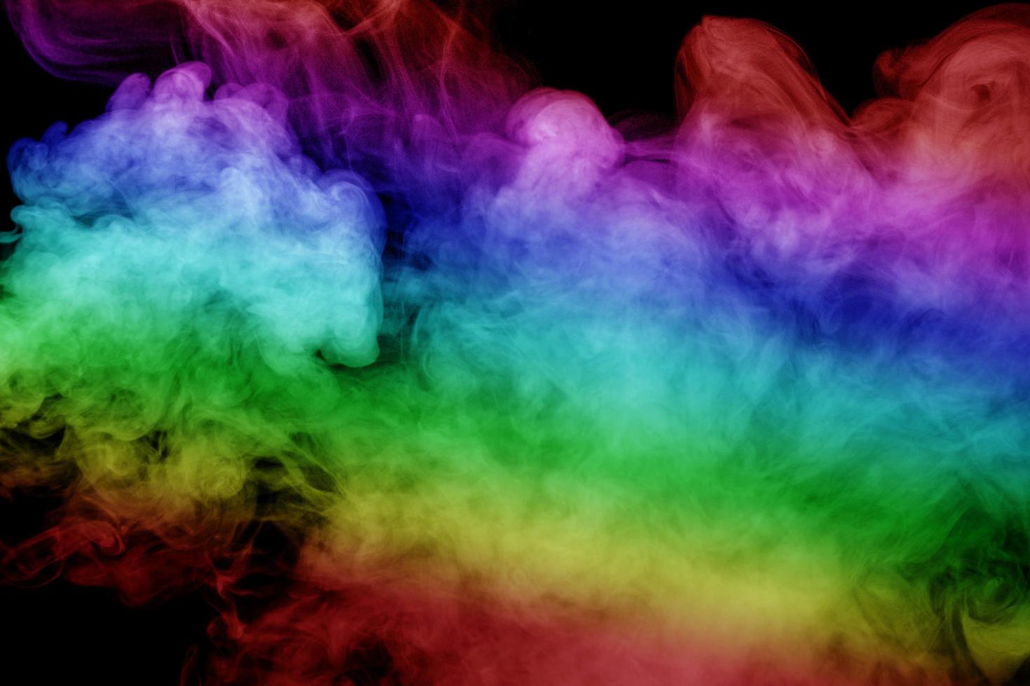 Abstract smoke isolated on black background,Rainbow powder photo