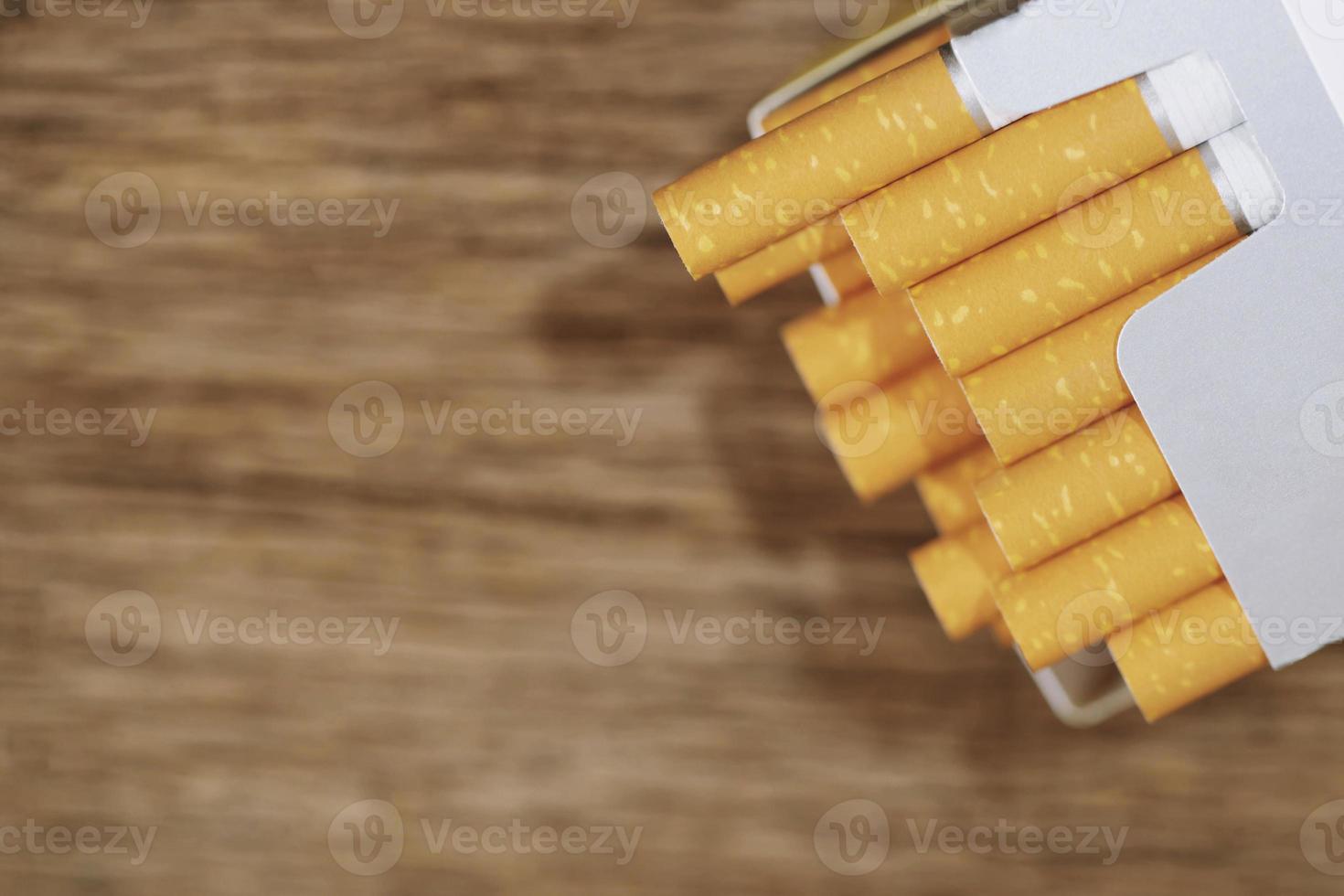 peel it off Cigarette pack prepare smoking. Packing line up put on the wooden table. photo filters Natural light.