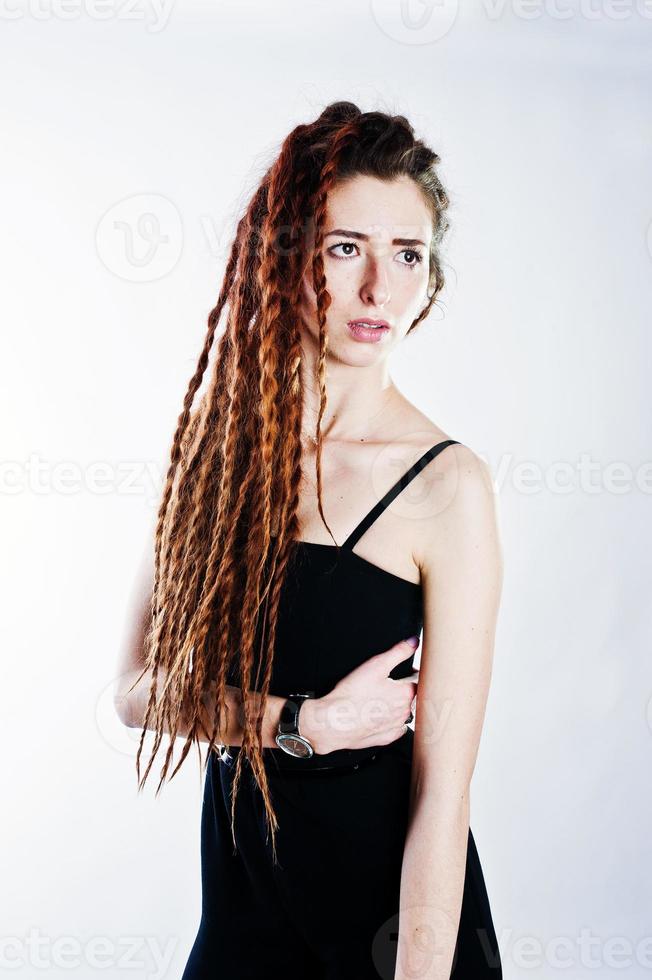 Studio shoot of girl in black with dreads on white background. photo