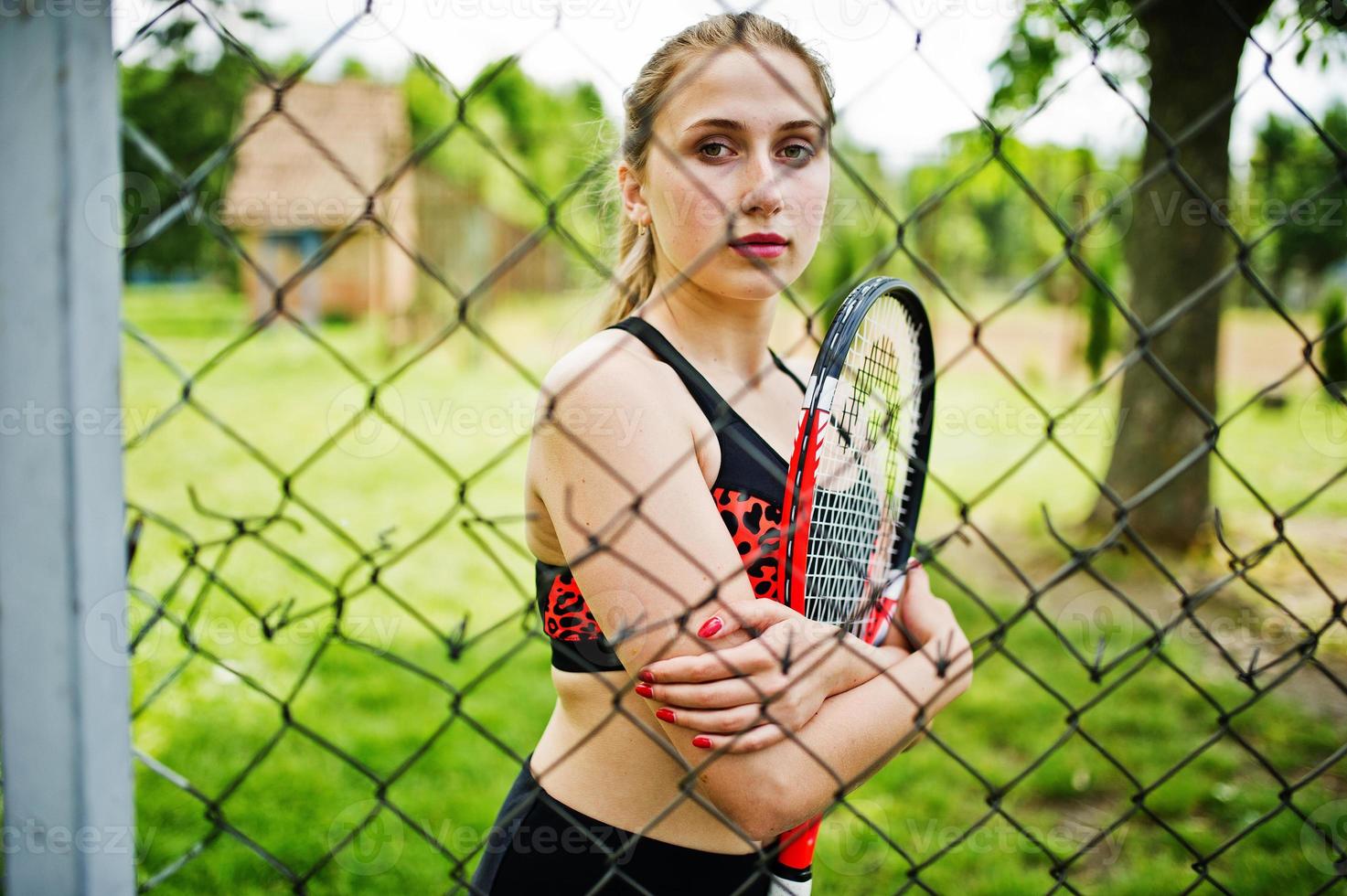 Beautiful sport woman tennis player with racket in sportswear costume. photo