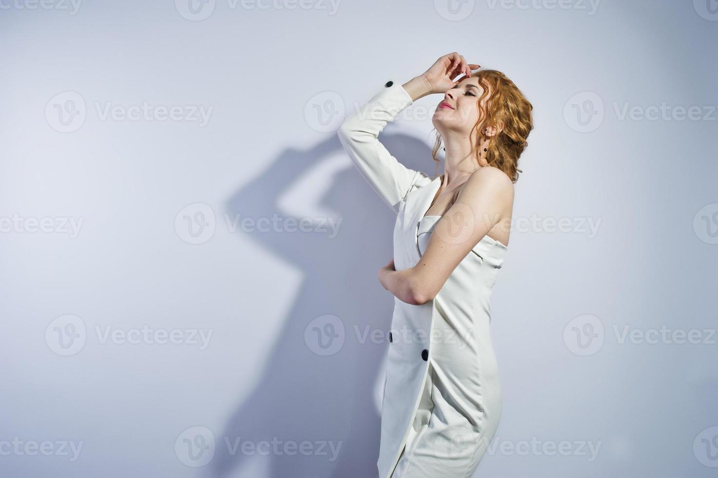 Curly hair girl isolated on white studio background. photo