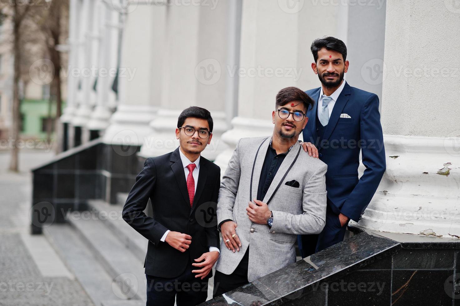 Group of three south asian indian mans in business suits wear. photo