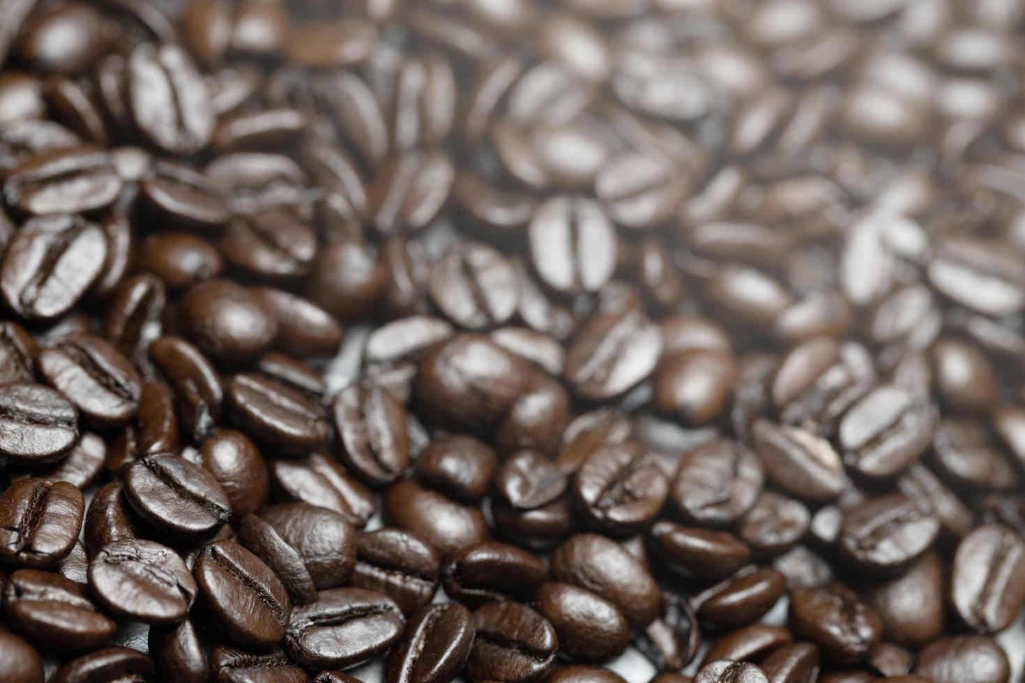 photo macro close up texture of roasted coffee beans dark, can be used as a background.