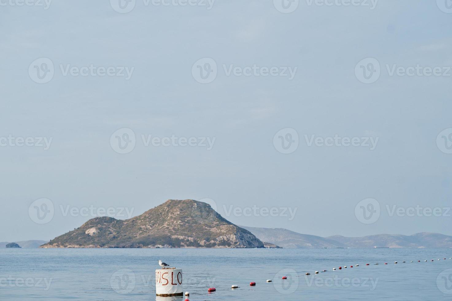 Alone island. Scenic landscape with mountain islands and blue lagoon on Aegean sea. Exotic scenery. Popular landmark, famous destination of Bodrum, Turkey. photo
