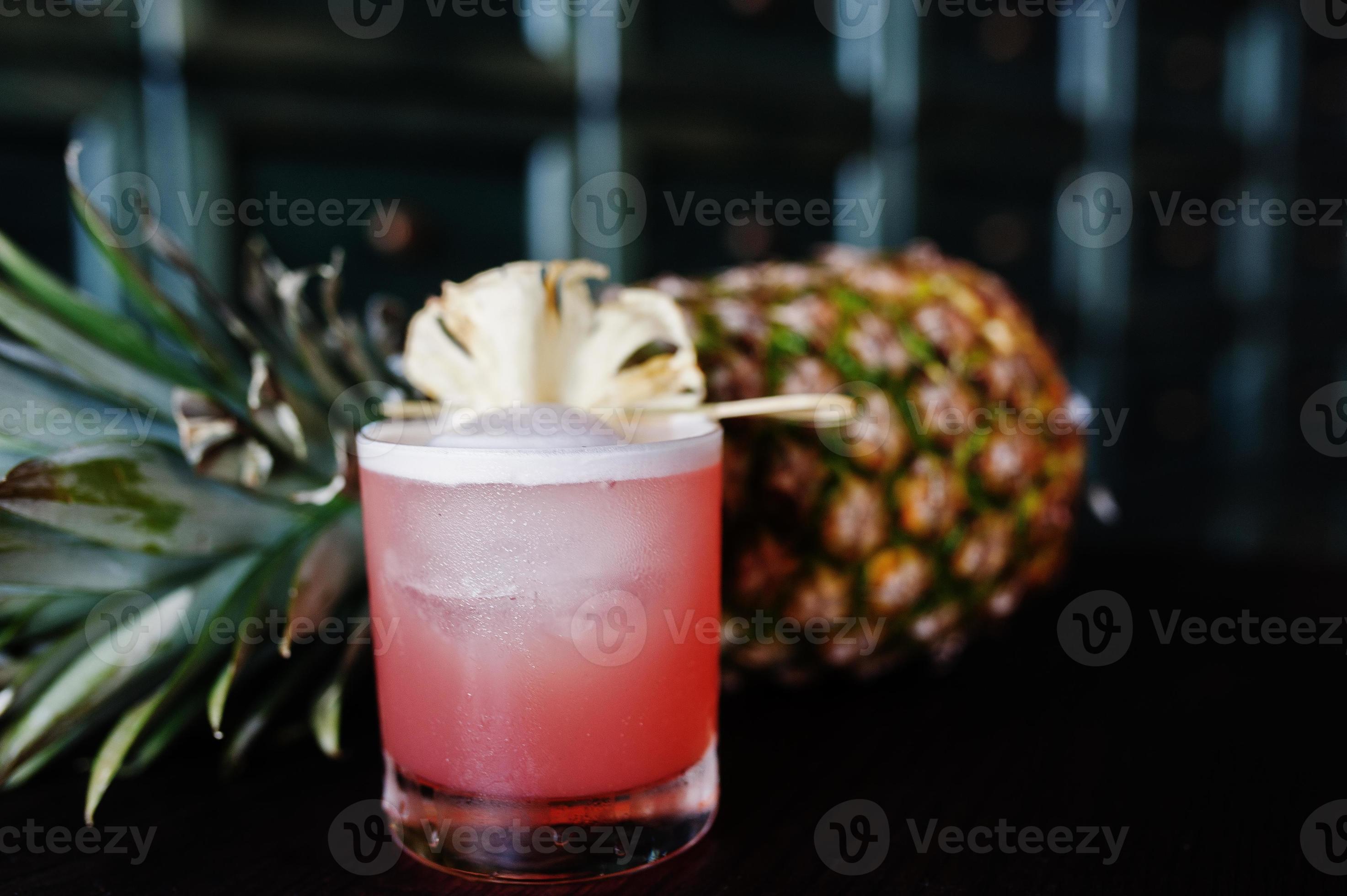 Alcoholic cocktail with pineapple at bar table. 10580367 Stock Photo at Vecteezy
