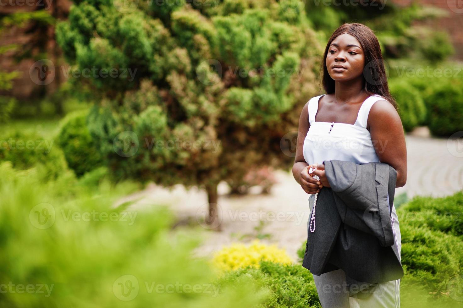 African american woman outdoor with rosary on hand. Concept for Faith, Spirituality and Religion. photo