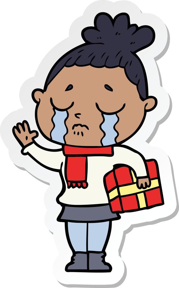 sticker of a cartoon crying woman with christmas gift vector