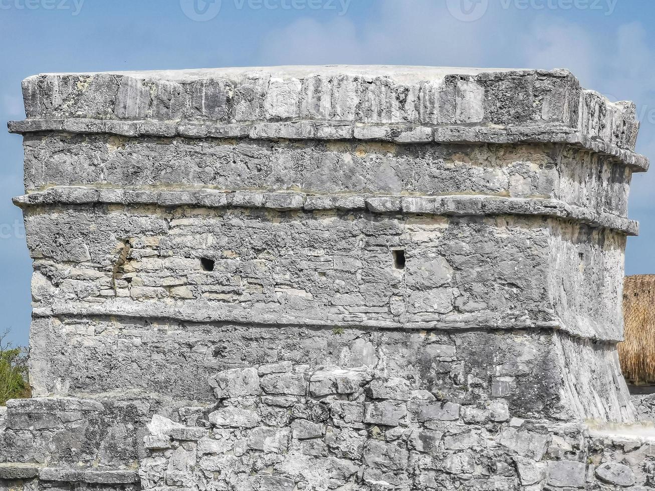 Ancient Tulum ruins Mayan site temple pyramids artifacts seascape Mexico. photo