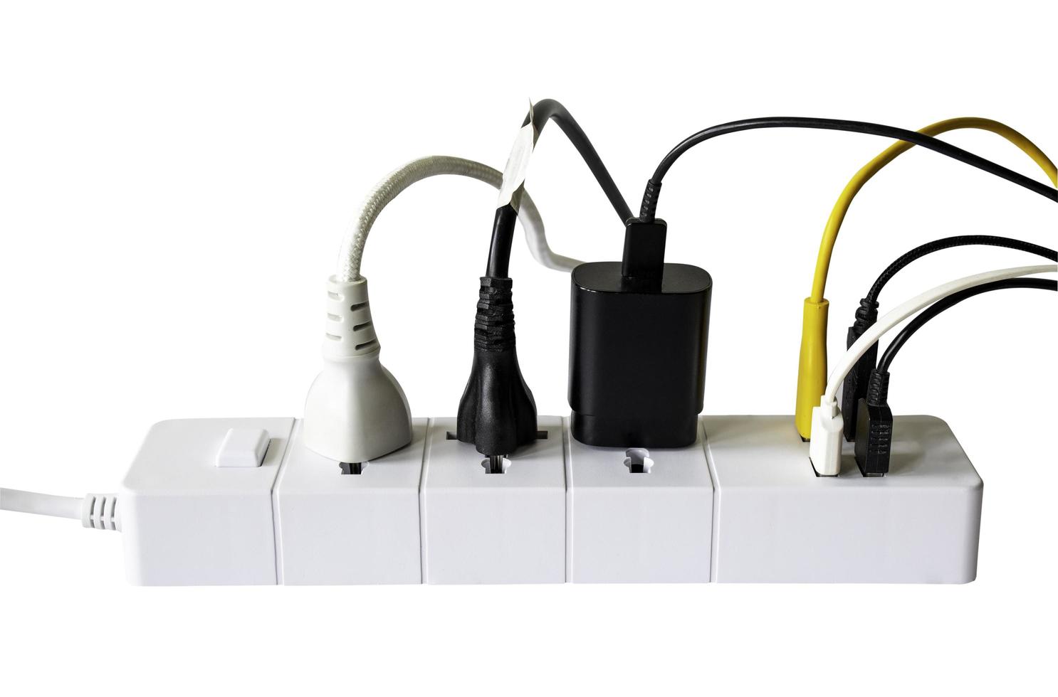 Extension power strip or trailer plug or extension cord with 3 electric plug and 4 USB charging hub ports isolated on white background. photo