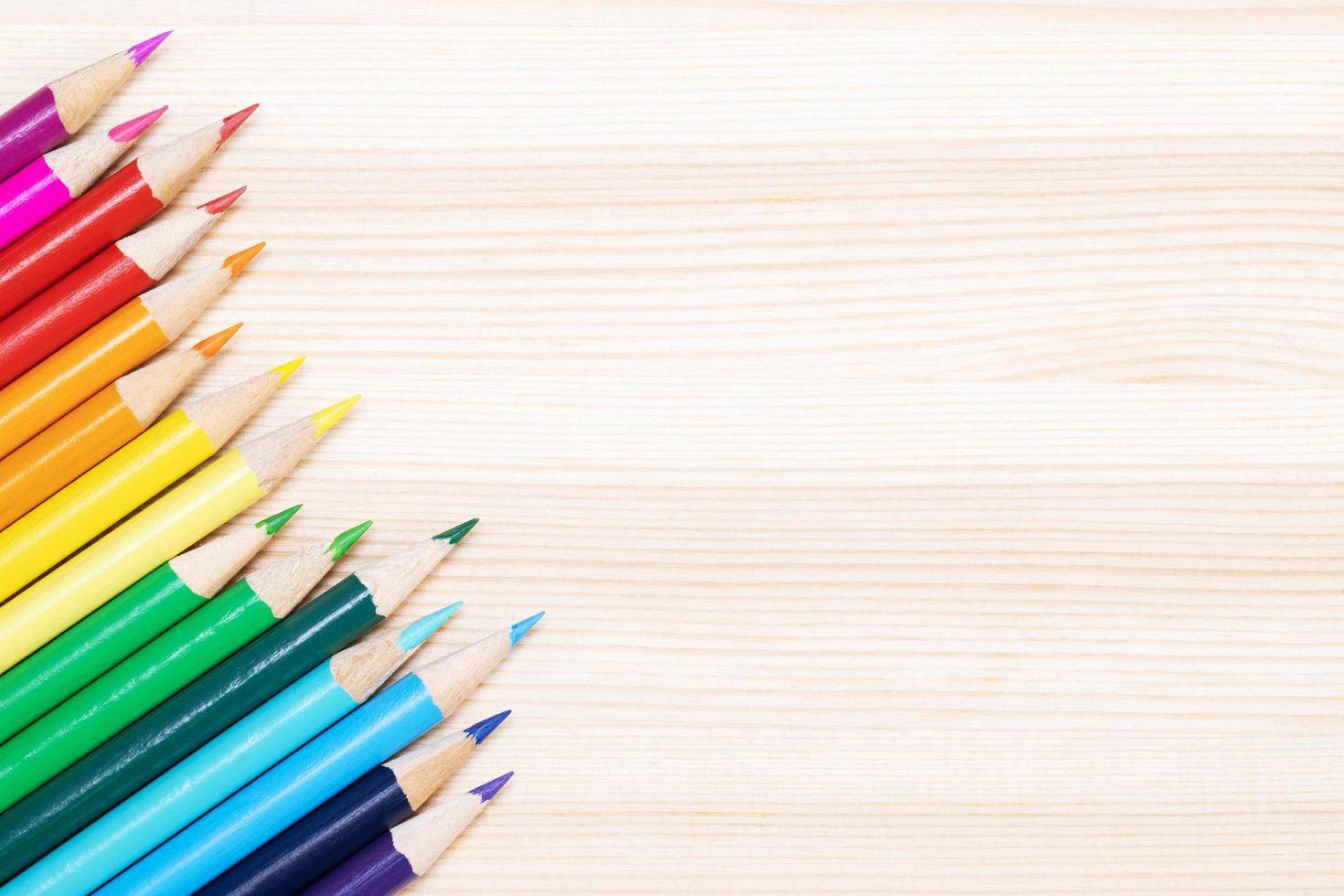 Close up of color pencils pile pencil tipped nibs put lined on the desk wooden. idea education back to school concept. Leave copy space empty for text. photo