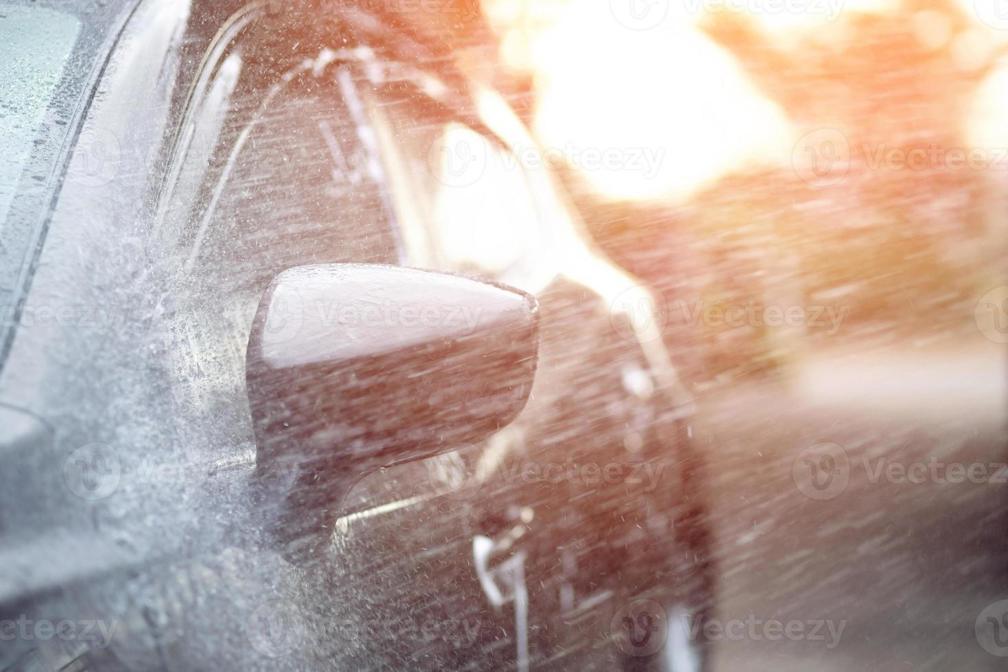 Car washing. Cleaning Car Using High Pressure Water. photo