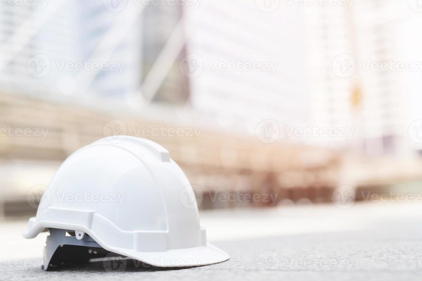 Construction safety engineer holding hard hat for safe work. photo