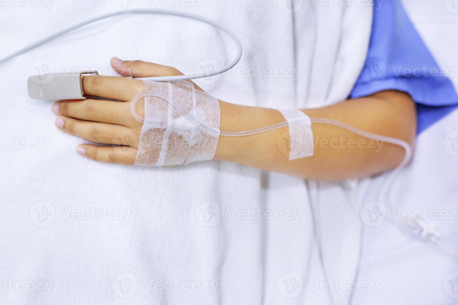 close up focus on the Shake hands of a patient sick encourage encouragement on the bed in hospital ward. photo