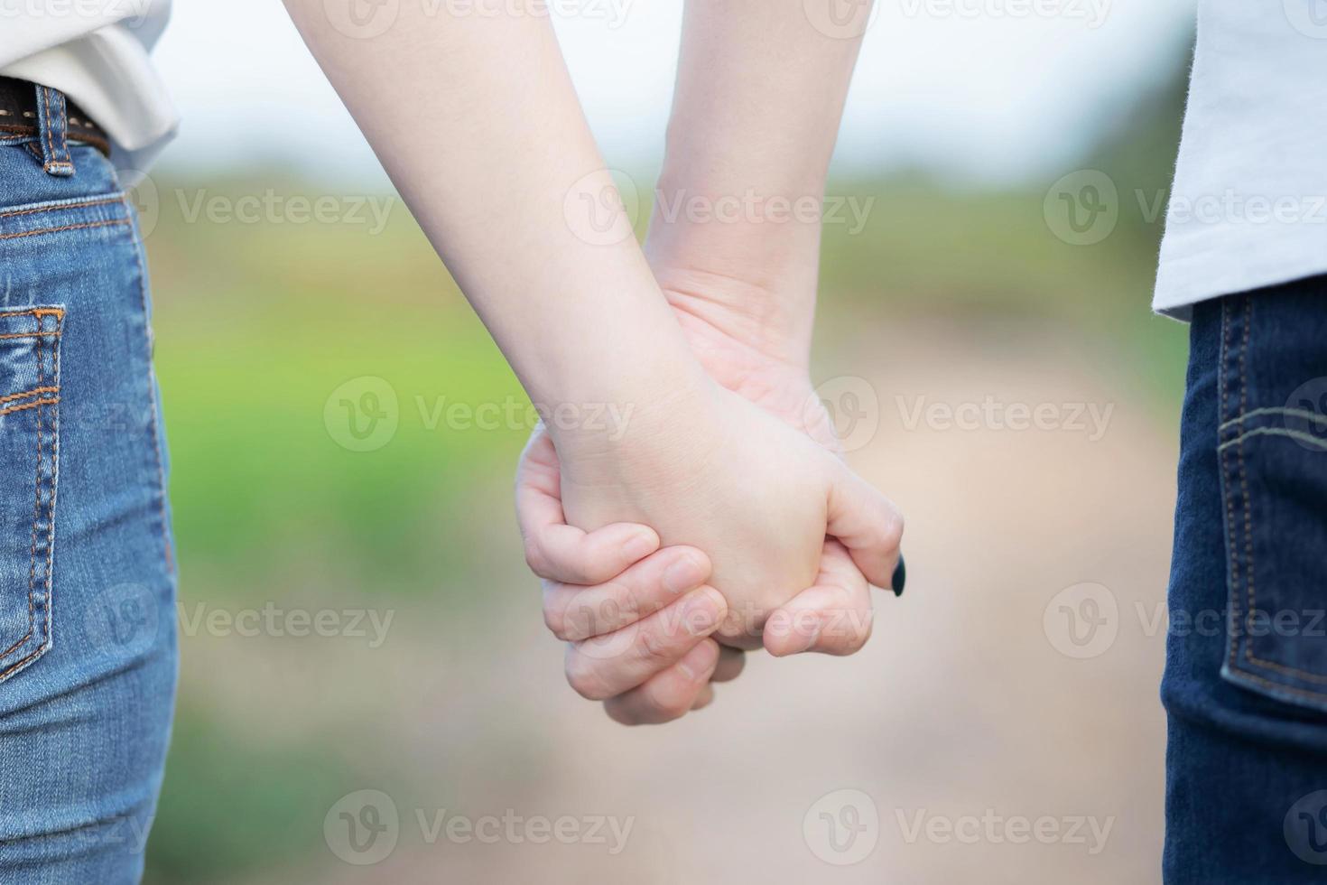 Woman and man holding hands, Happy couple love in the outdoor. concept lover valentine day. photo