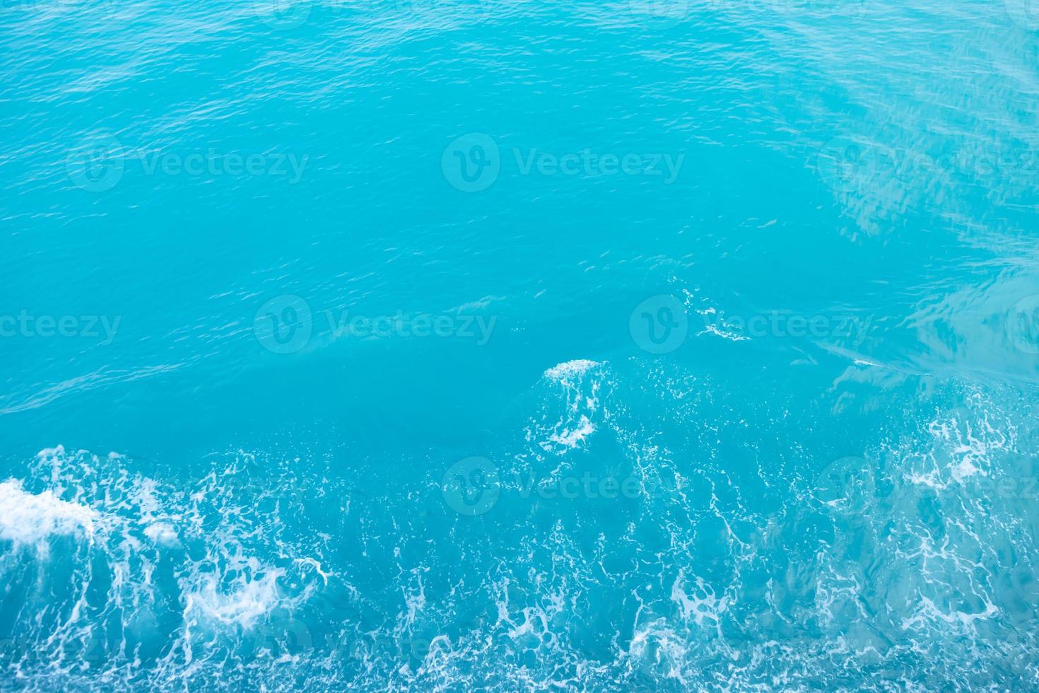 Sea  Waves in ocean wave Splashing Ripple Water. Blue water background. Leave space to write descriptive text. photo