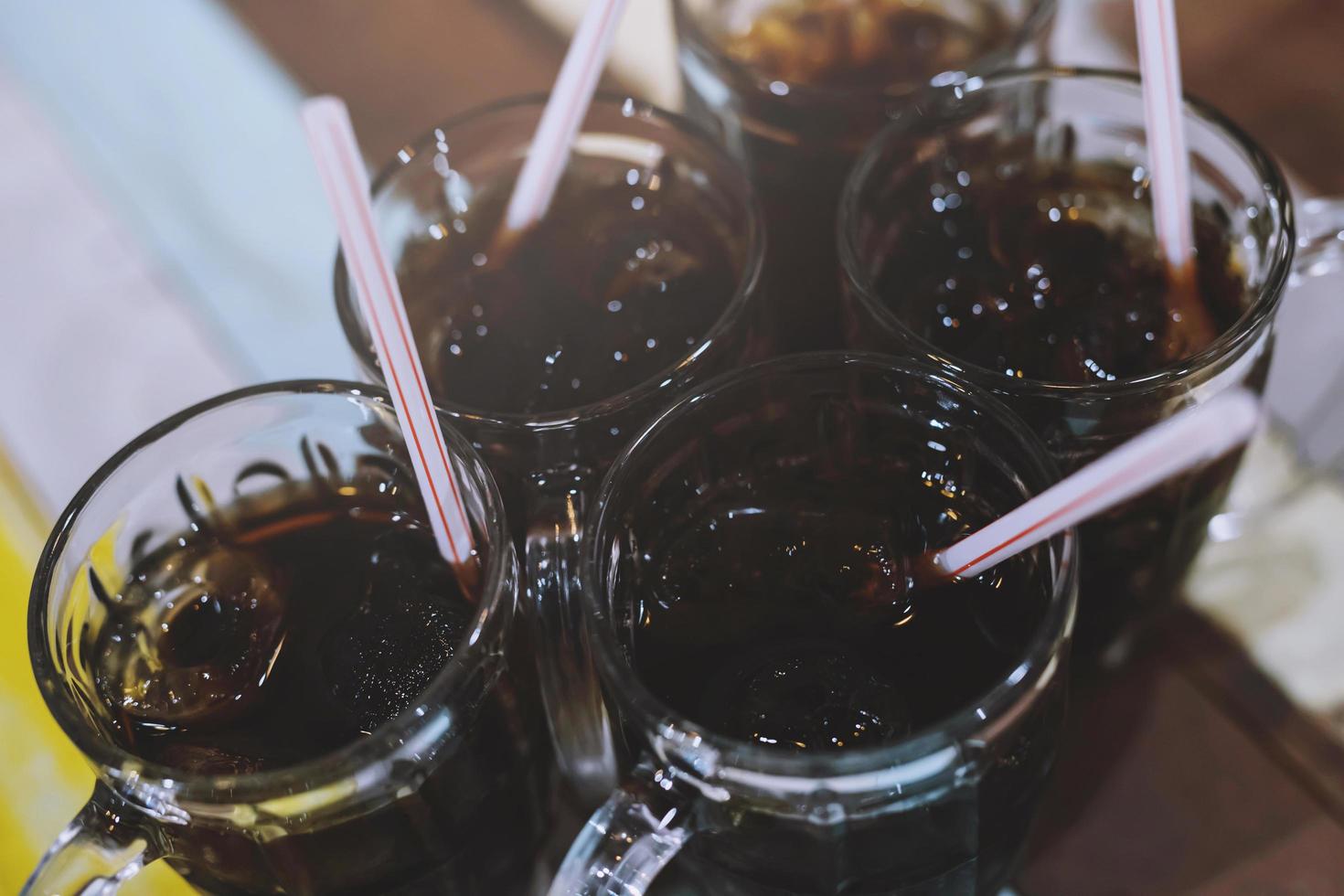 different many soft drink are in a glass on wooden table. sparkling water. Leave space to write descriptive text. photo