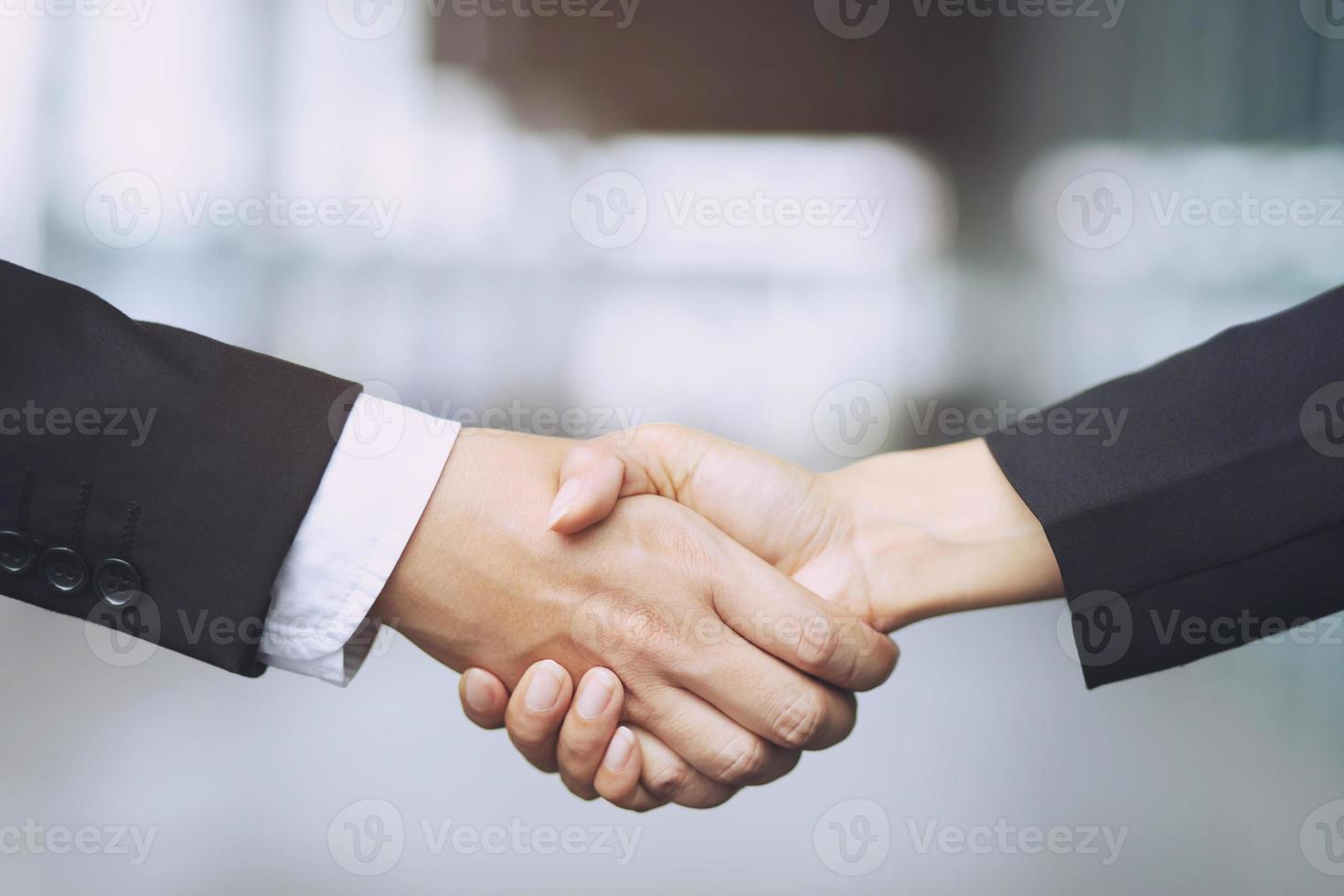 auto business. Close up of a business man dealer offer car to new owner and hand shake between two congratulations to customers. filter tone outdoor sunny in the morning. photo