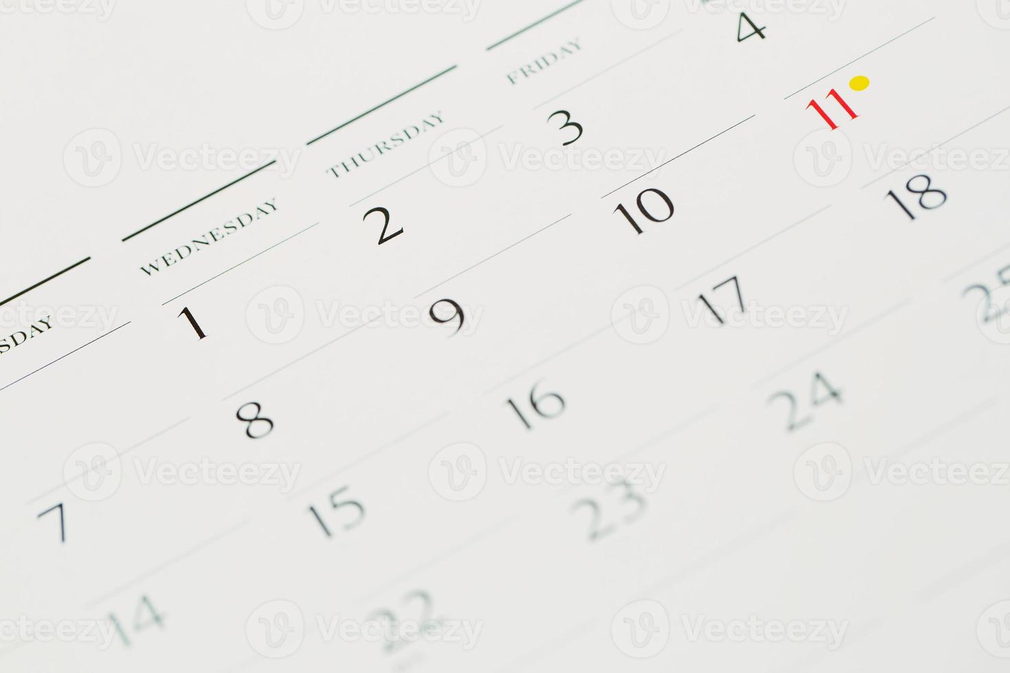 Thumbtack in calendar concept for busy, appointment and meeting reminder photo