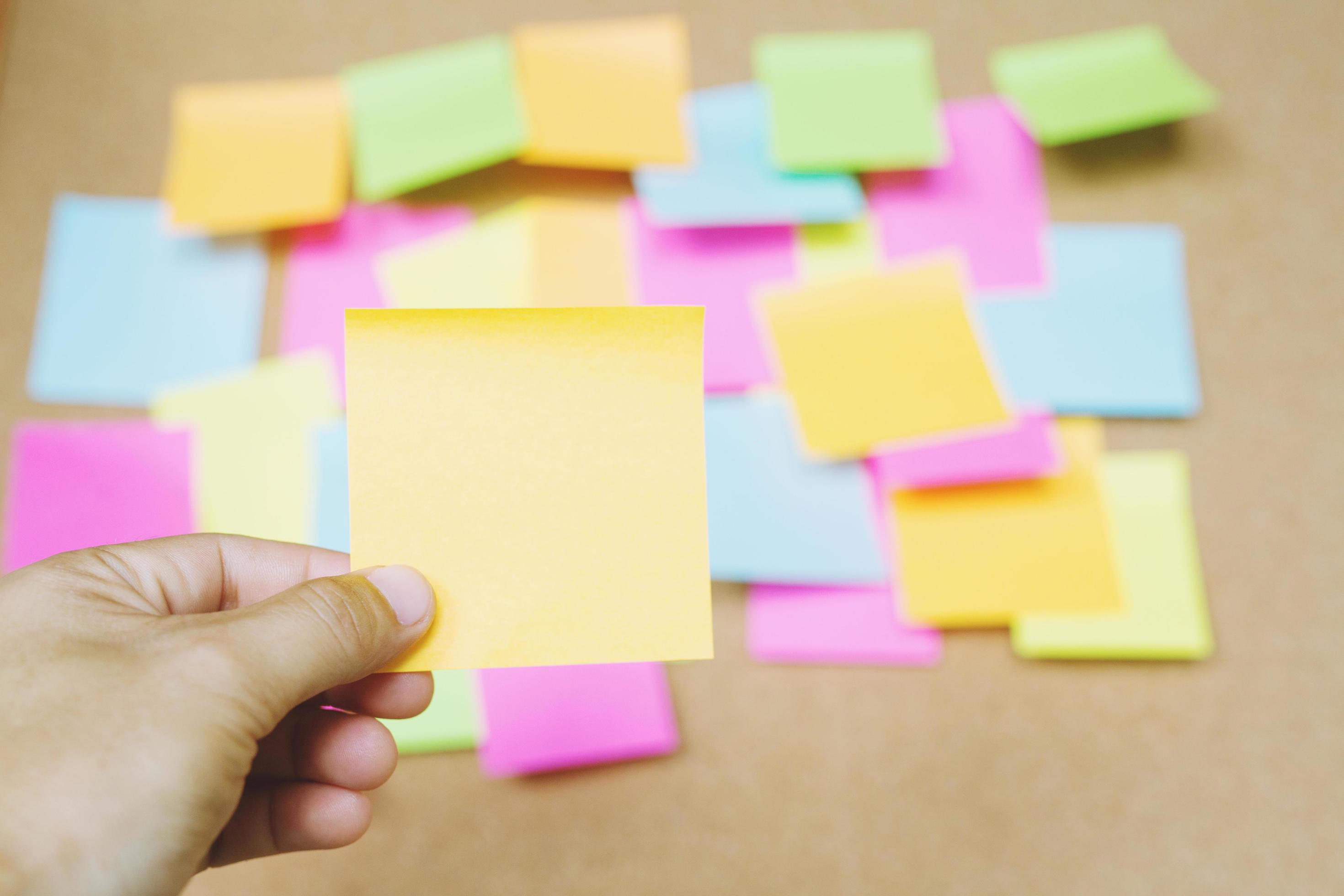 collection of colorful variety post it. paper note reminder sticky notes  pin on cork bulletin board. empty space for text. Stock Photo