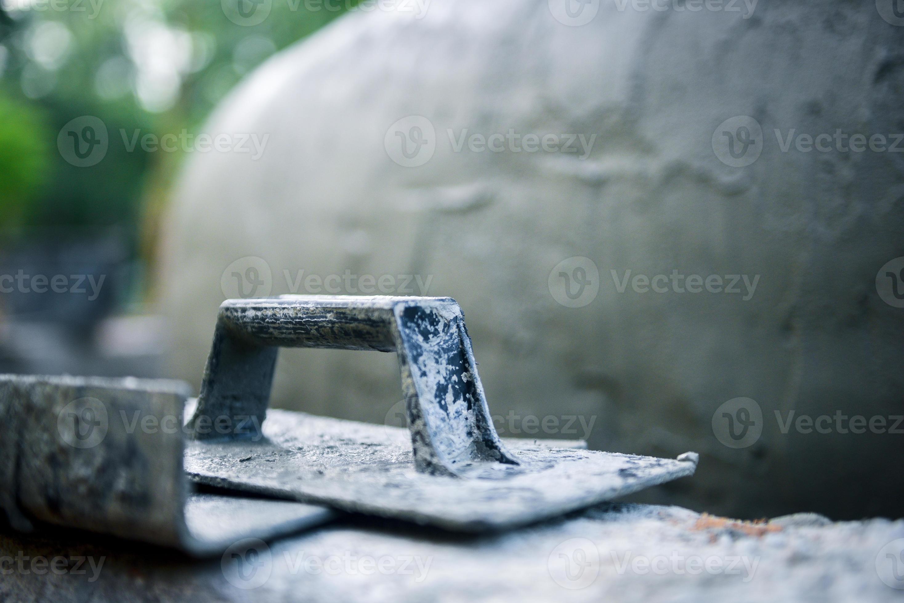 Closeup Buttering Trowel construction equipment for building the house with sunlight, Concept