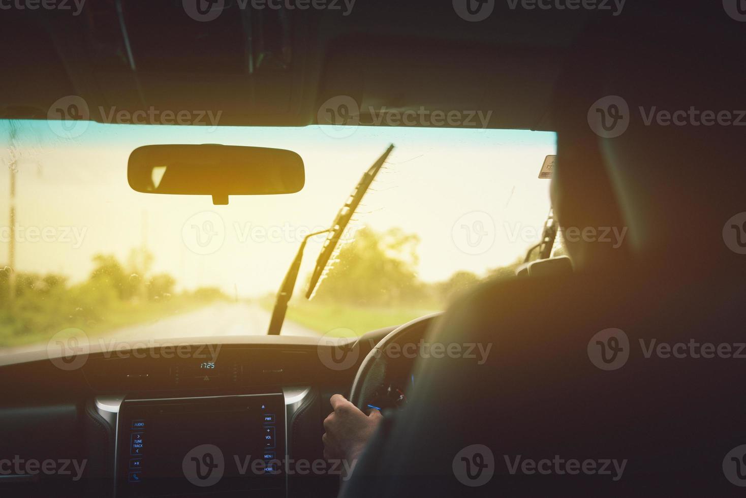 Man driving car from rear view on the highway.Vintage filter photo