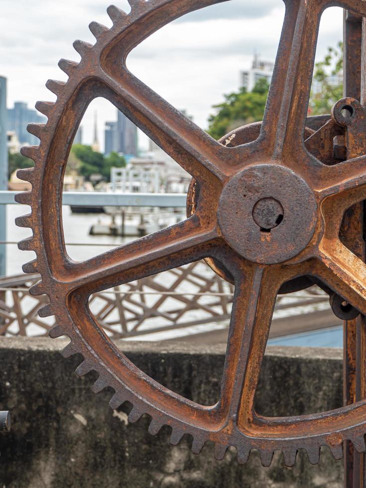 Rusty and metallic gear wheel, part of old boat winch photo