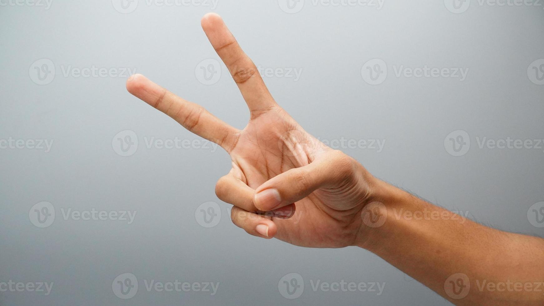 victory hand sign isolated on white background photo