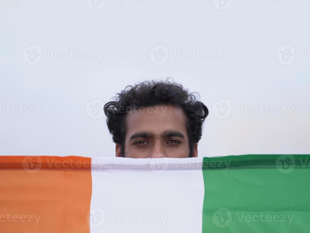 patriotic indian boy with indian flag photo