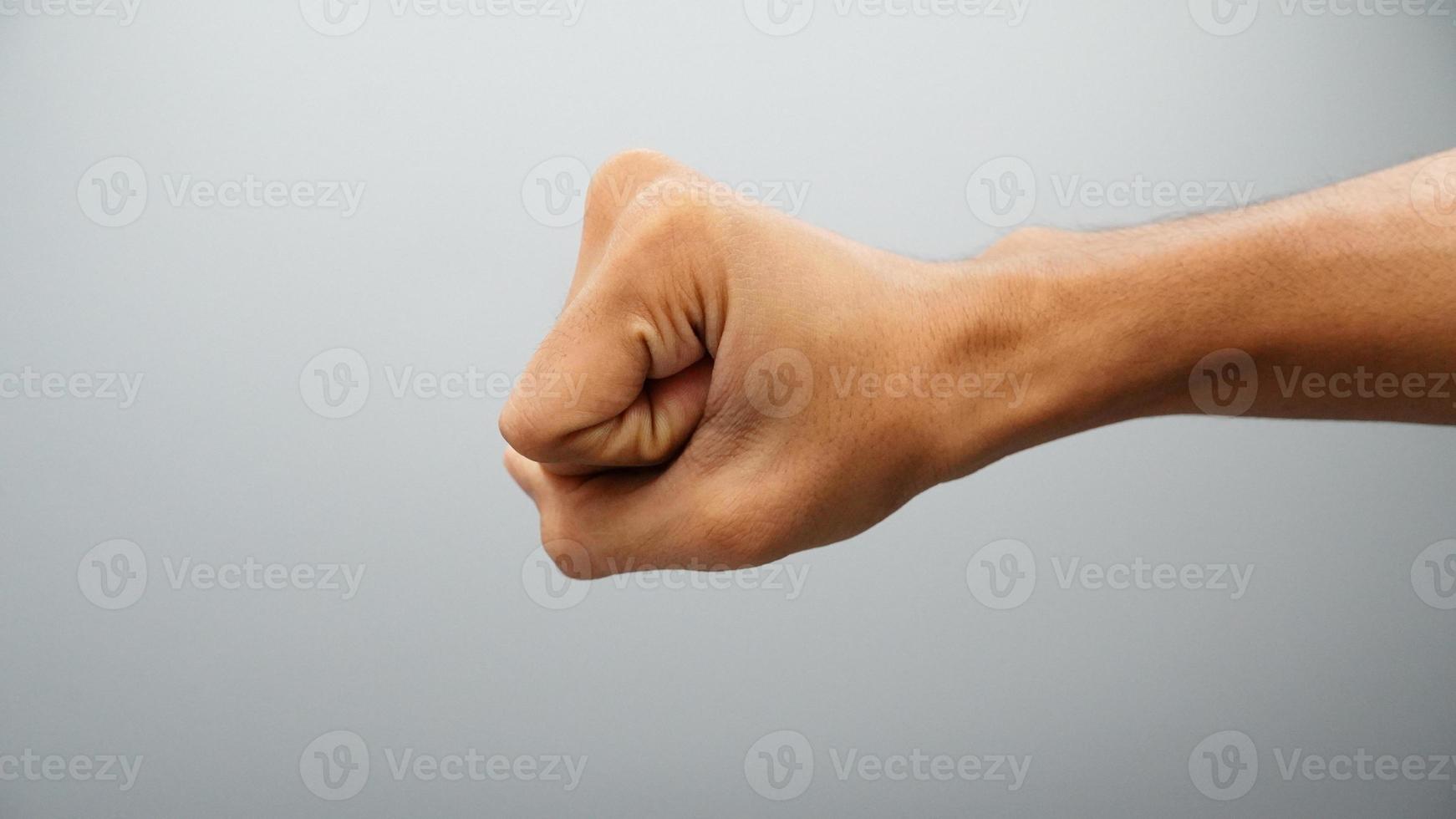 punch hand sign isolated on white background photo