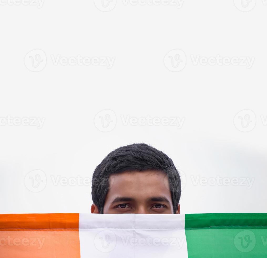 patriotic indian boy with indian flag photo