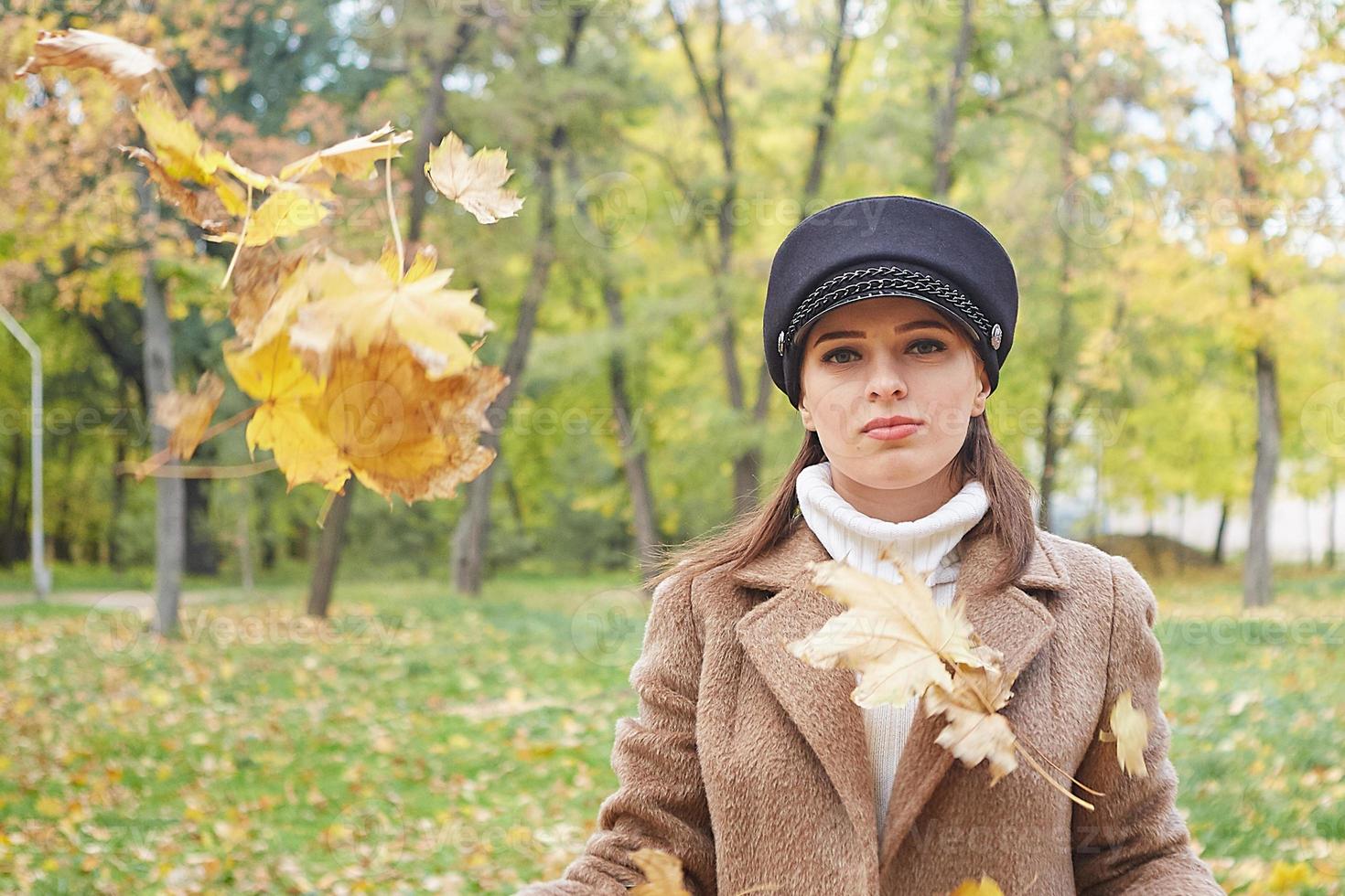 Beautiful gentle woman in the autumn park photo