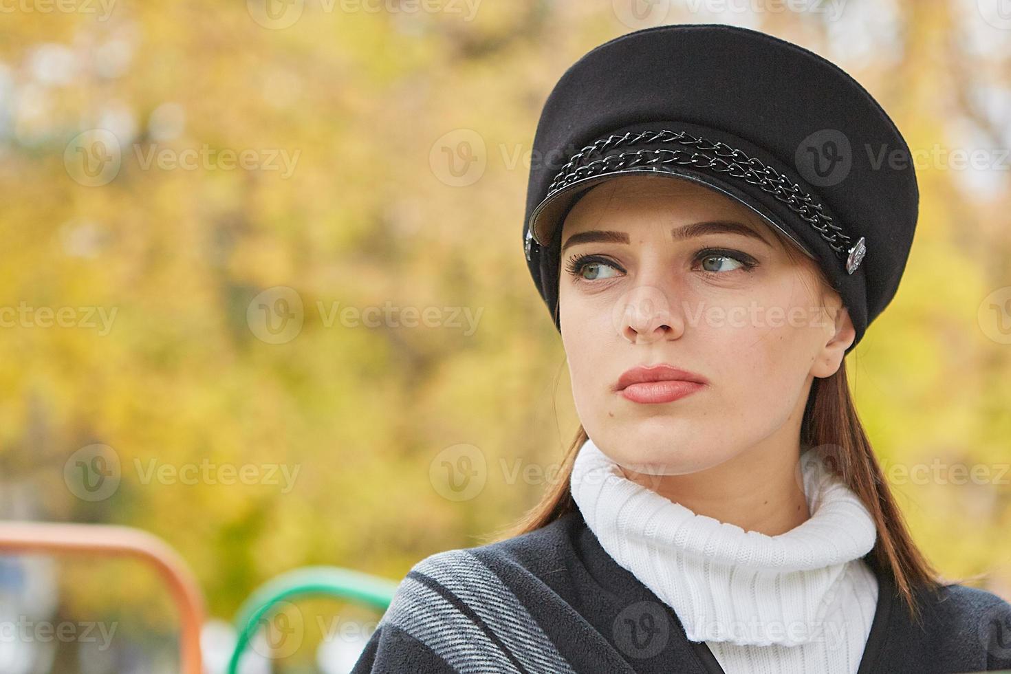 Beautiful gentle woman in the autumn park photo