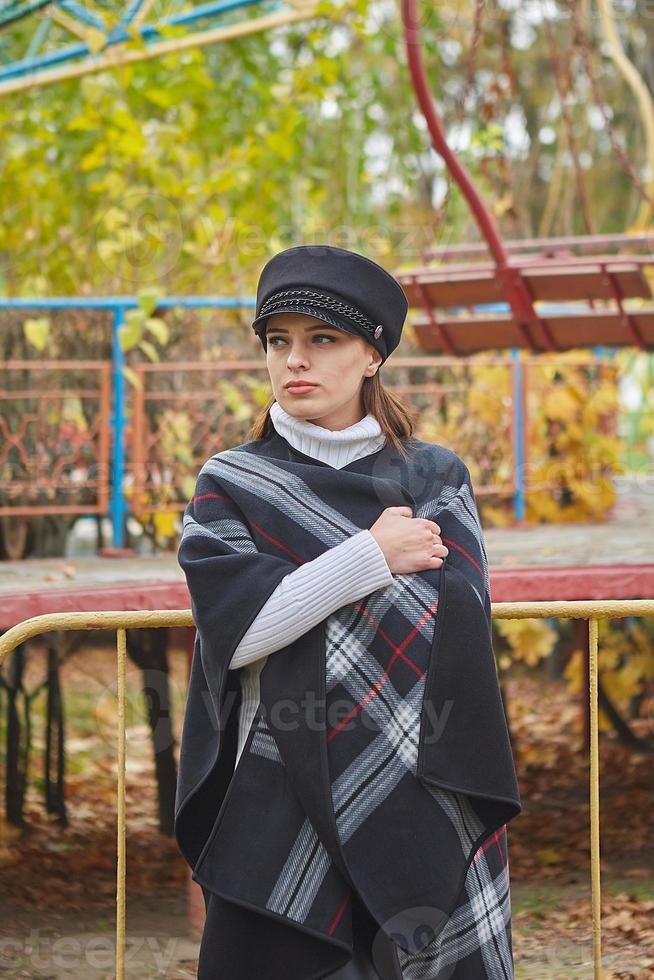 Beautiful gentle woman in the autumn park photo
