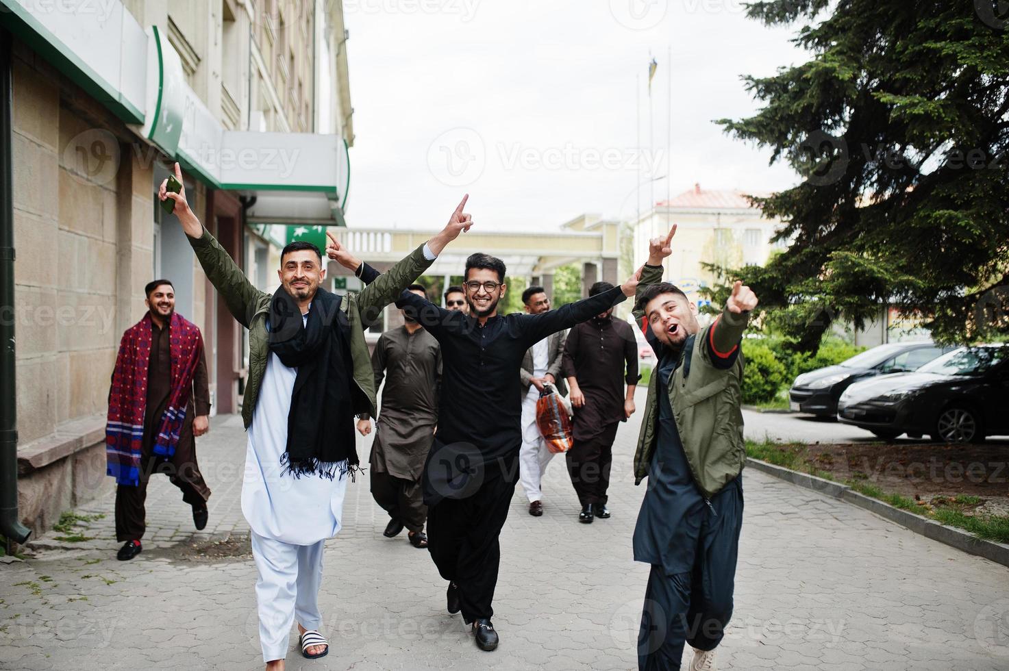 Group of pakistani man wearing traditional clothes salwar kameez or kurta. photo